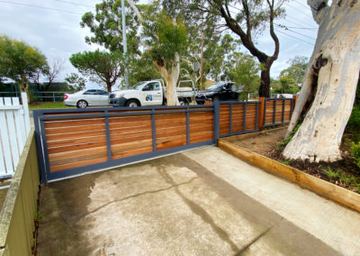 Custom Horizontal Slatted Spotted Gum Timber on Aluminium Frame Sliding Driveway Gate