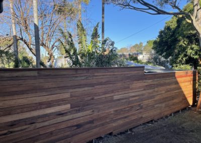 Custom Horizontal Slatted Spotted Gum Timber Fence sealed with Cutek
