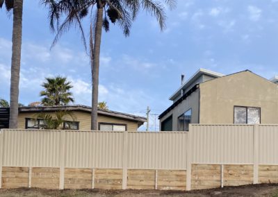 Colorbond Boundary Fencing with Treated Pine Sleeper Retaining Wall and Colorbond Key Lockable Pedestrian Gate