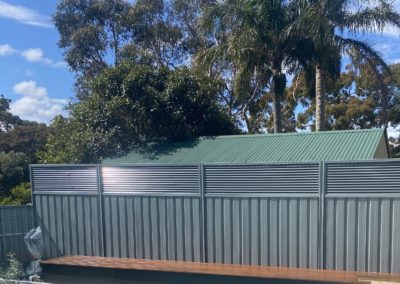 Custom Powdercoated Aluminium Angled Slatted Panels on Colorbond fence