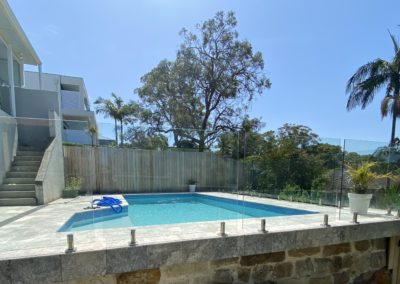 Frameless Glass Pool Fence and Treated Pine Butted Paling Fence