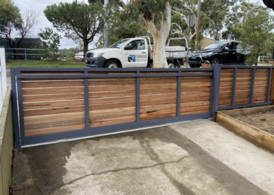 Custom Horizontal Slatted Spotted Gum Timber on Aluminium Frame Sliding Driveway Gate